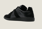 MM Black nappa leather with the iconic stitching at the back.